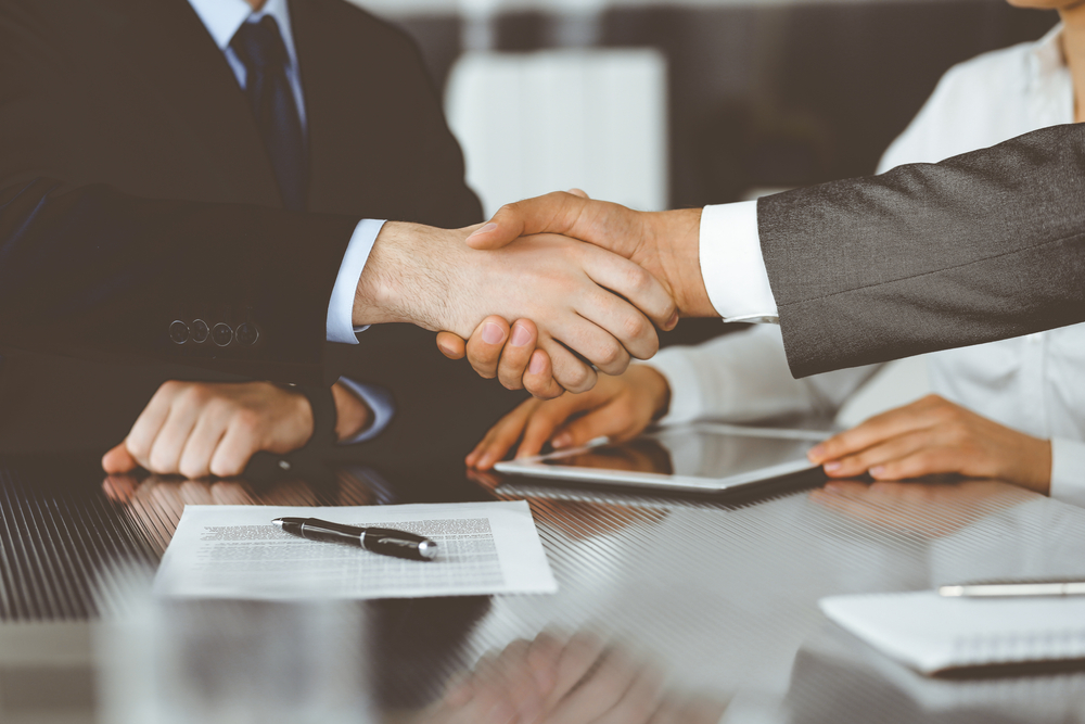 Handshake,as,successful,negotiation,ending,,close up.,unknown,business,people,shaking